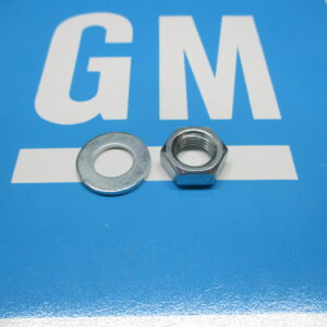 A Nut and a Washer on a Blue Color Surface