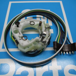 A white non tilt component with wires on a blue surface