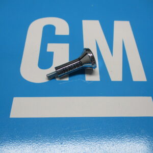 A nut of floor shift on a blue background on a blue surface