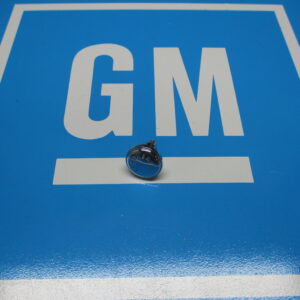 Head of the nut of a floor shift placed on a blue surface