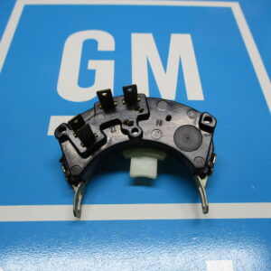 A GM Non Tilt Steering Column Bearing kept on a blue surface