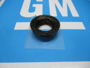 A bearing kept on a plastic sheet placed on a blue surface