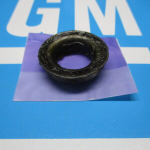Closeup view of a black bearing placed on a blue surface