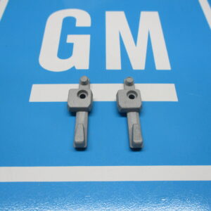Two turn signal wire protective covers on a blue surface
