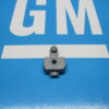 A turn signal wire protective cover on a blue surface