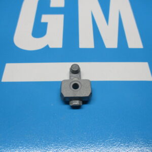 A turn signal wire protective cover on a blue surface