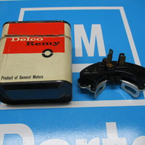A Delco Remy Box With Spare Part on a blue surface