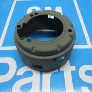 A green color machine part on a blue surface