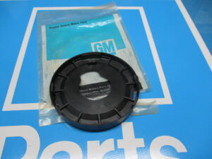 A black component placed on the top of a plastic cover