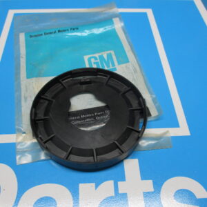 A black component placed on the top of a plastic cover